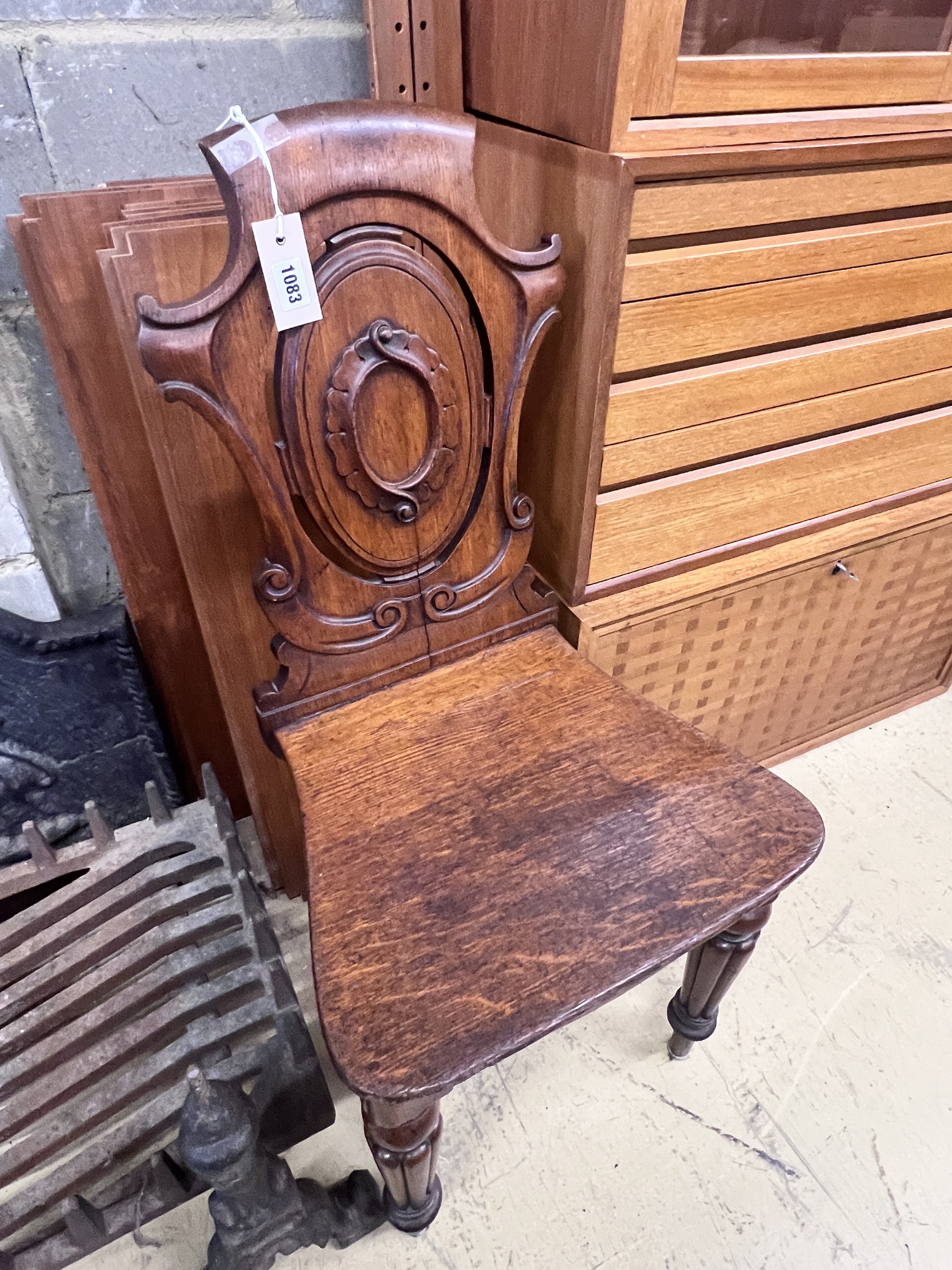 A Victorian oak hall chair